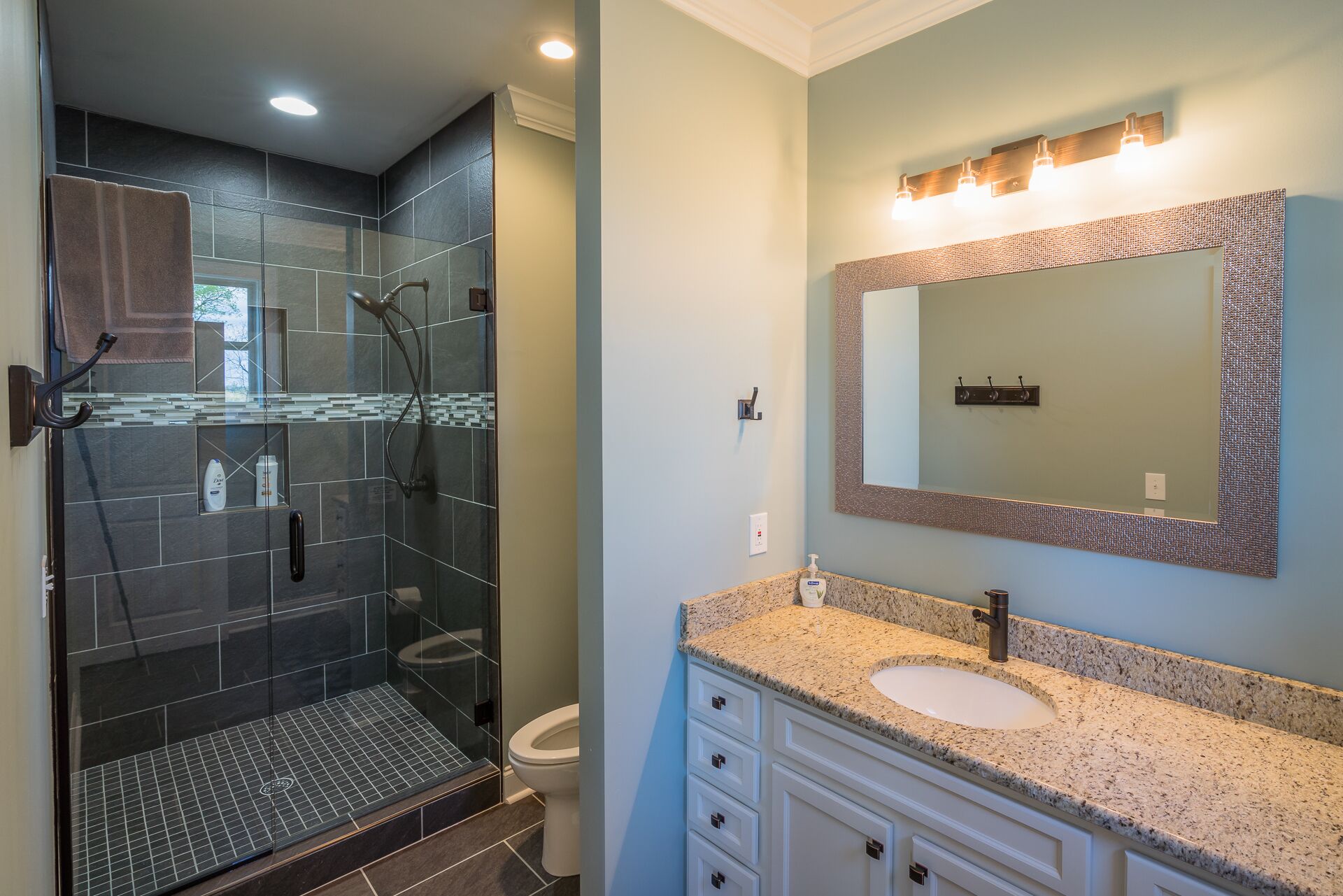 One of 4 full bathrooms with gorgeous custom tile showers