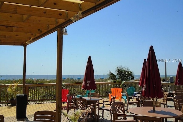 View from the poolside restaurant with attached bar and shaved ice stand.