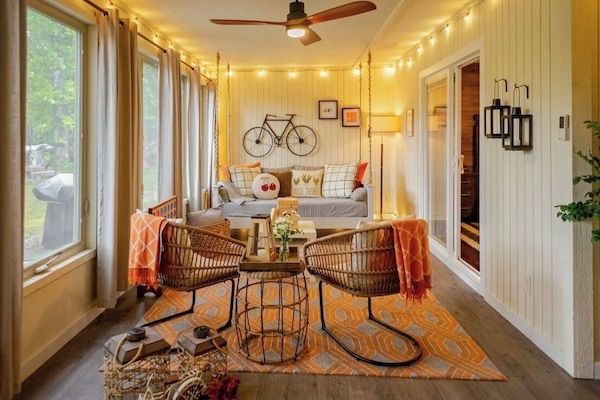 Relax in our sunroom with a swing bed