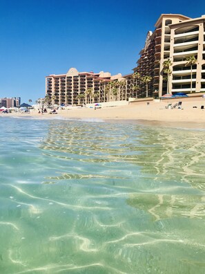 On the beach, sun loungers, beach towels