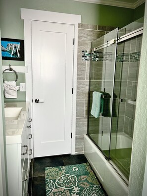 Combined shower/tub, hair dryer, towels, soap