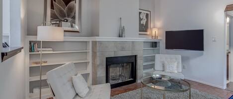 Smart TV, fireplace, books