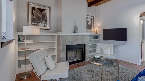 Smart TV, fireplace, books