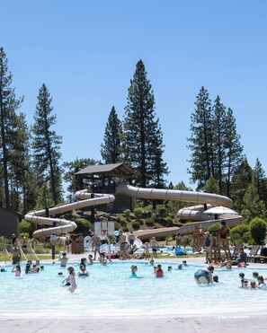 A water park with multiple slides and a pool area.