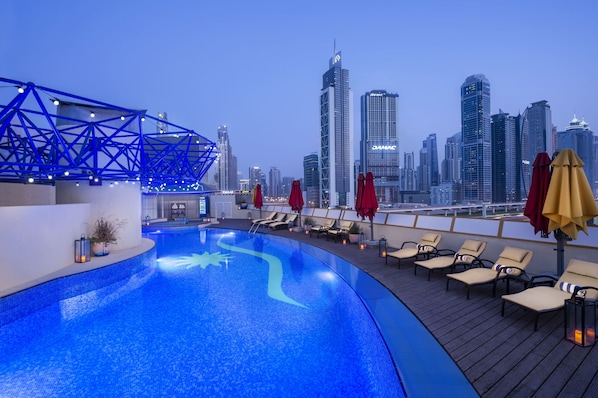 Outdoor pool, open 7:00 AM to 8:00 PM, pool umbrellas, pool loungers - Leva Hotel and Suites, Mazaya Centre (Dubai)