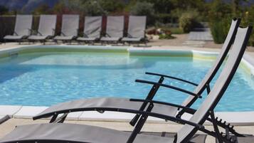 Seasonal outdoor pool, pool umbrellas, pool loungers