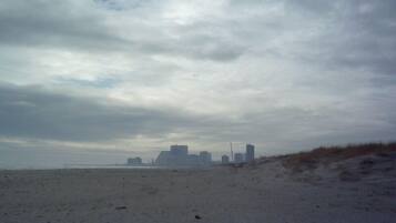 On the beach, sun-loungers