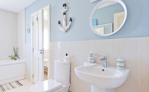 Combined shower/tub, hair dryer, towels, soap