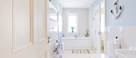 Combined shower/bathtub, hair dryer, towels, soap