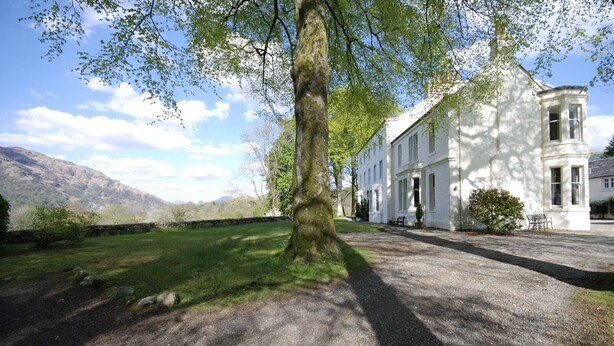 A white building with multiple windows and a stone pathway leading to it. - The Edwardian Wing, 18th Century Oak with Wing inserts (Taynuilt)