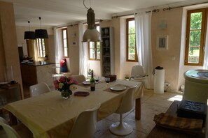 Dinning room with views of river and kitchen.