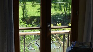 A window with a view of a green landscape and a body of water. - Beautifully Restored, Large French Villa On The Banks Of The River Cele. (Cabrerets)
