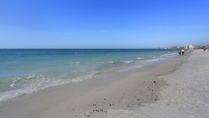 A beach with clear skies and calm waters. - Beautiful, updated, oceanfront views!  Gorgeous unit! (Marco Island)