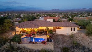 A residential house with a swimming pool, patio, and mountain views. - Spectacular Views! Heated Pool. Game Room. Private. Spacious. (Fountain Hills)
