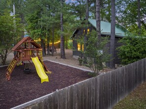 Children's area - Kingfisher ~ Riverfront cabin with play set, hot tub, kayaks, and river access (Broken Bow)