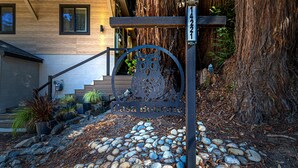 A metal sign with the text "Casa Boheme" and a number "14221" mounted on a post. - Casa Boheme-Stylish, Relaxing, Close to Downtown! (Guerneville)