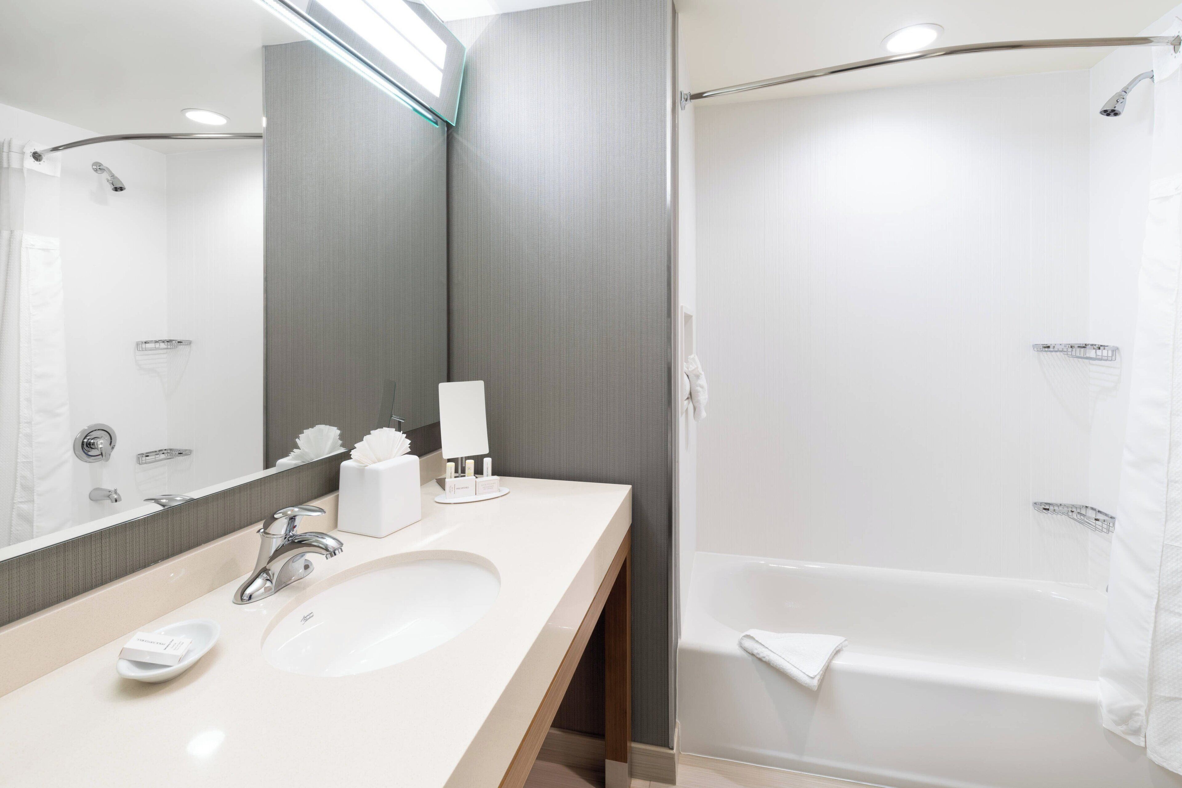 room, 2 queen beds | bathroom | shower, free toiletries, hair dryer, towels