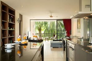 Penthouse | Private kitchen | Full-size fridge, microwave, stovetop, cookware/dishes/utensils - Bangtao Beach Garden By RESAVA (Choeng Thale)