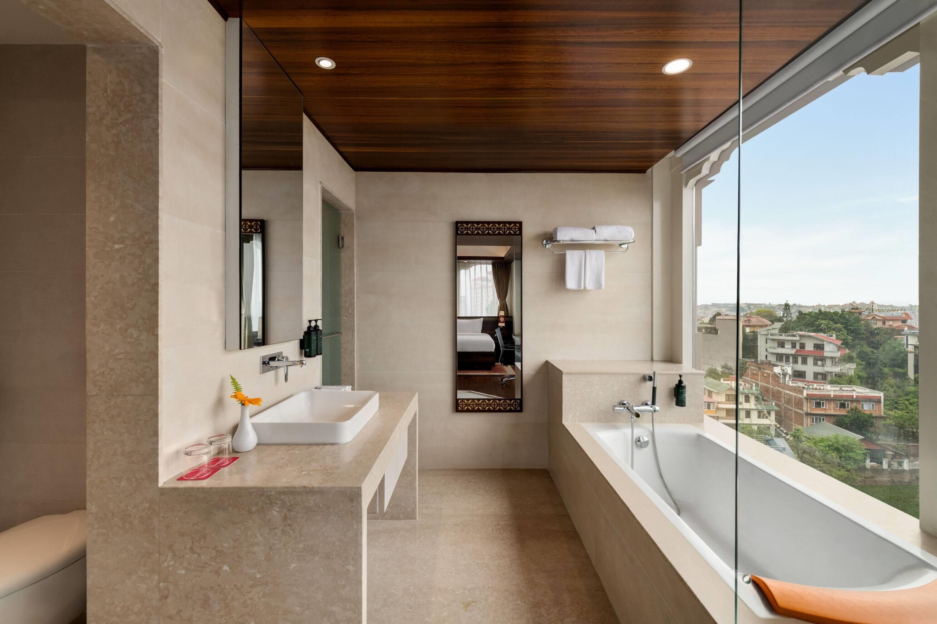 junior suite, 1 king bed | bathroom | shower, free toiletries, hair dryer, bathrobes