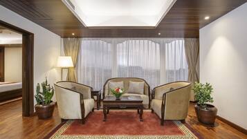 Family Suite, 2 Bedrooms | Living area | 43-inch flat-screen TV with satellite channels, TV