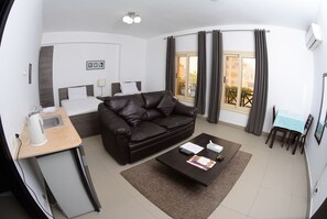 Deluxe Triple Room, City View | Hypo-allergenic bedding, minibar, soundproofing, free WiFi