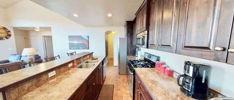 Coffee/tea maker, fridge, microwave, oven