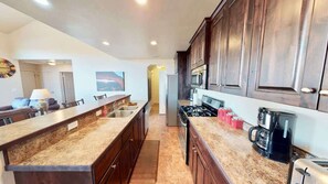 Coffee/tea maker, fridge, microwave, oven