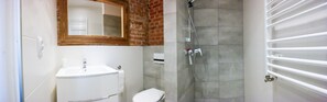 Triple Room, Kitchenette | Bathroom | Shower, hair dryer, towels