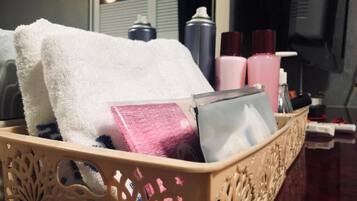 Shower, free toiletries, hair dryer, slippers