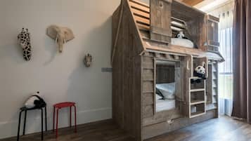 Cozy children's bed with a ladder and a special space for a favorite toy.