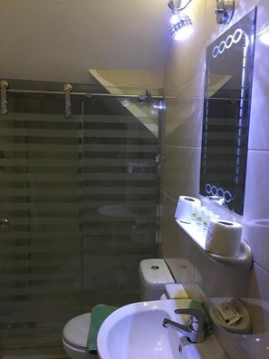 Shower, free toiletries, slippers, towels