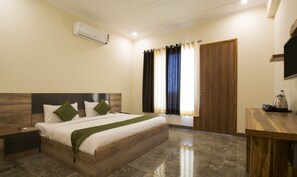 Deluxe Room - For National Indian Only | Desk, soundproofing, iron/ironing board, cribs/infant beds - Treebo Corporate 32 (Gurugram)