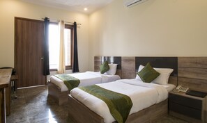 Deluxe Room - For National Indian Only | Desk, soundproofing, iron/ironing board, cribs/infant beds - Treebo Corporate 32 (Gurugram)