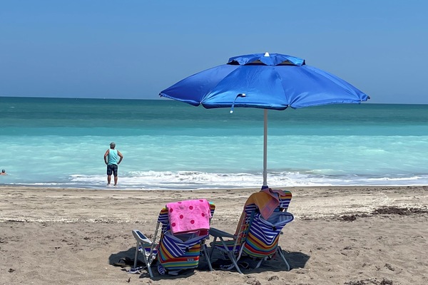 On the beach, sun-loungers, beach towels