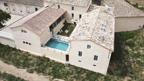 A large estate with multiple buildings, a swimming pool, and a well-maintained lawn. - Chartreuse de Mougeres (Caux)