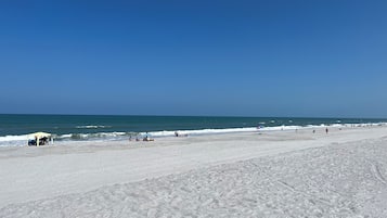 On the beach, sun-loungers