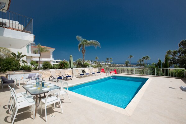 Outdoor pool, a heated pool, pool loungers