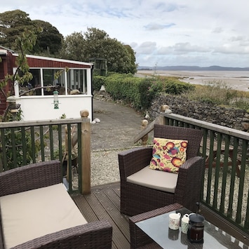 The elevated decking and the conservatory