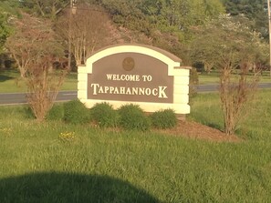 Welcome to Tappahannock, set against a lush backdrop of trees.
