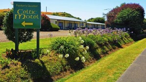 A motel sign indicating 'Foxton's Quietest Celtic Motel' with a directional arrow.