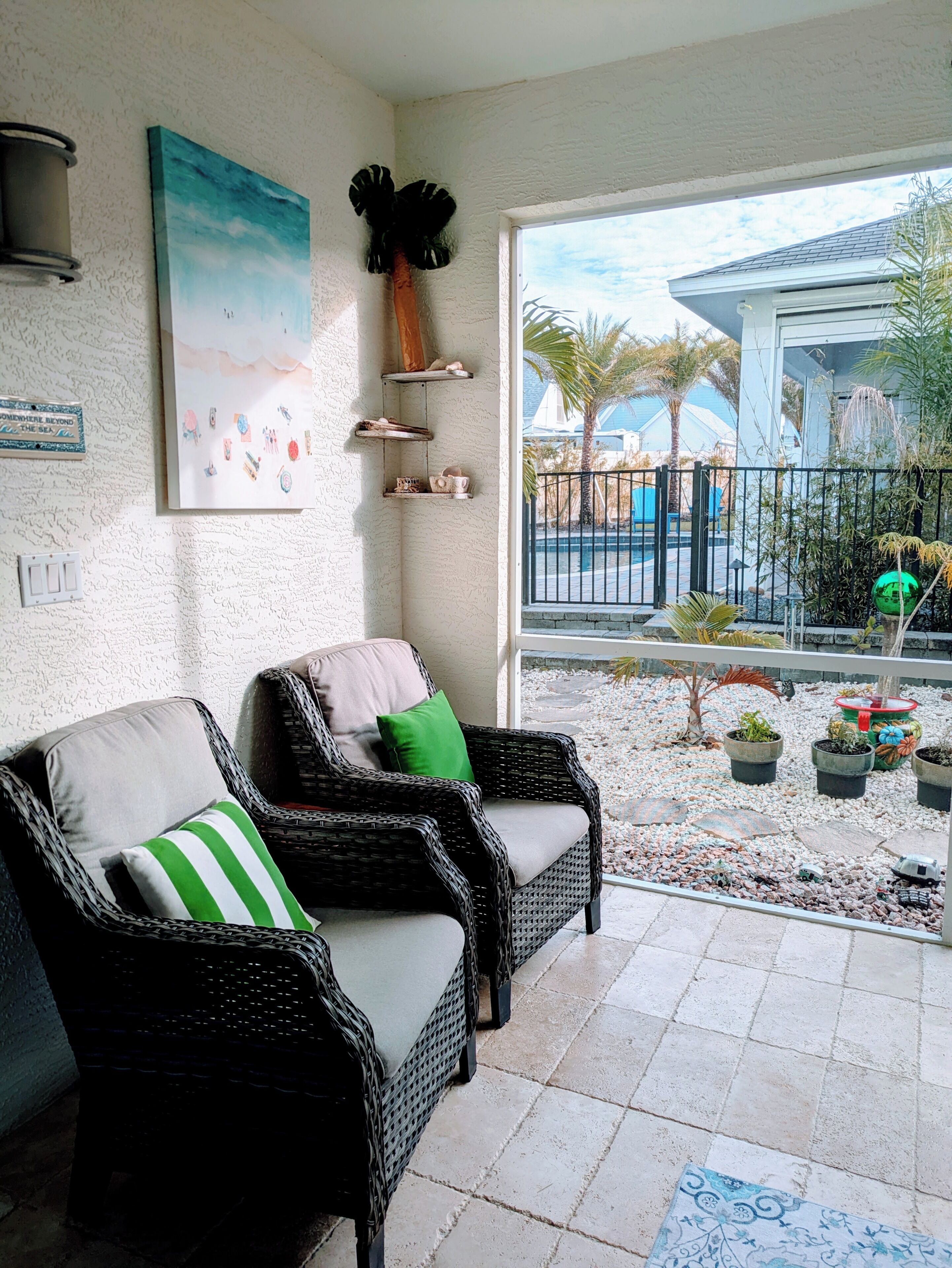 Relax in the breezeway. (the pool is the neighbor's)