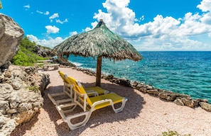 On the beach, sun loungers, beach towels