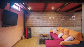 Smart TV, fireplace, table football, books
