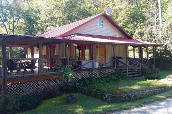 Our wonderful home with lots of porches, right on the edge of the Chauga River !