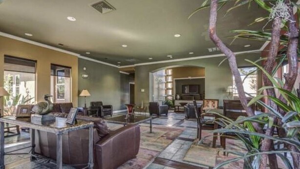 A spacious lobby with a mix of seating areas, including sofas and armchairs, a coffee table, and a reception desk. - Upscale stay 2.5 blocks to Kierland and Scottsdale Commons shopping.   (Scottsdale)