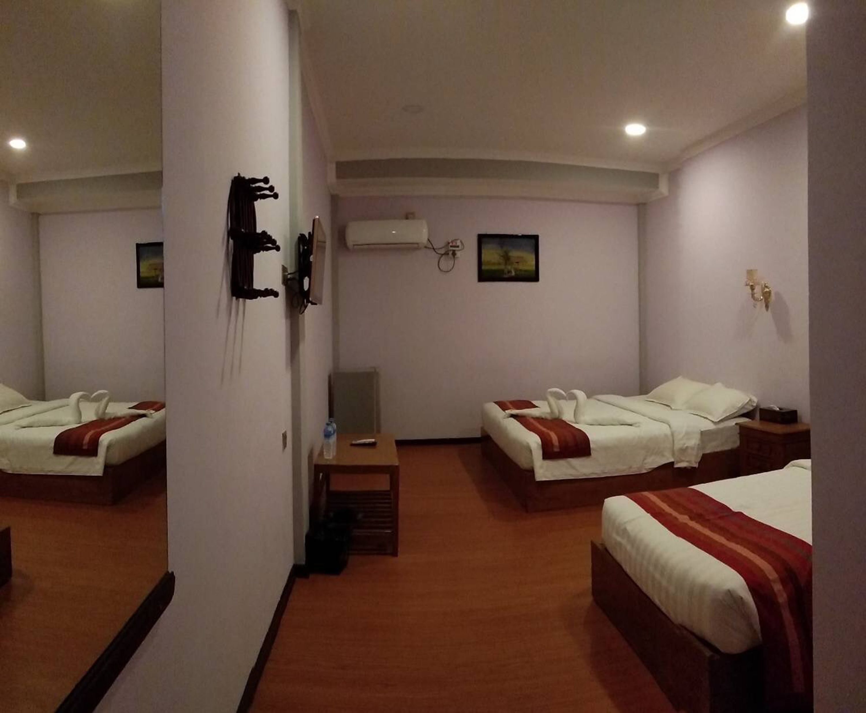 Standard Triple Room | Minibar, blackout drapes, free WiFi, bed sheets