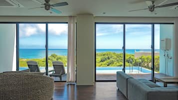 side.B sora, Luxury Condominium with Private Pool | Living area | Flat-screen TV