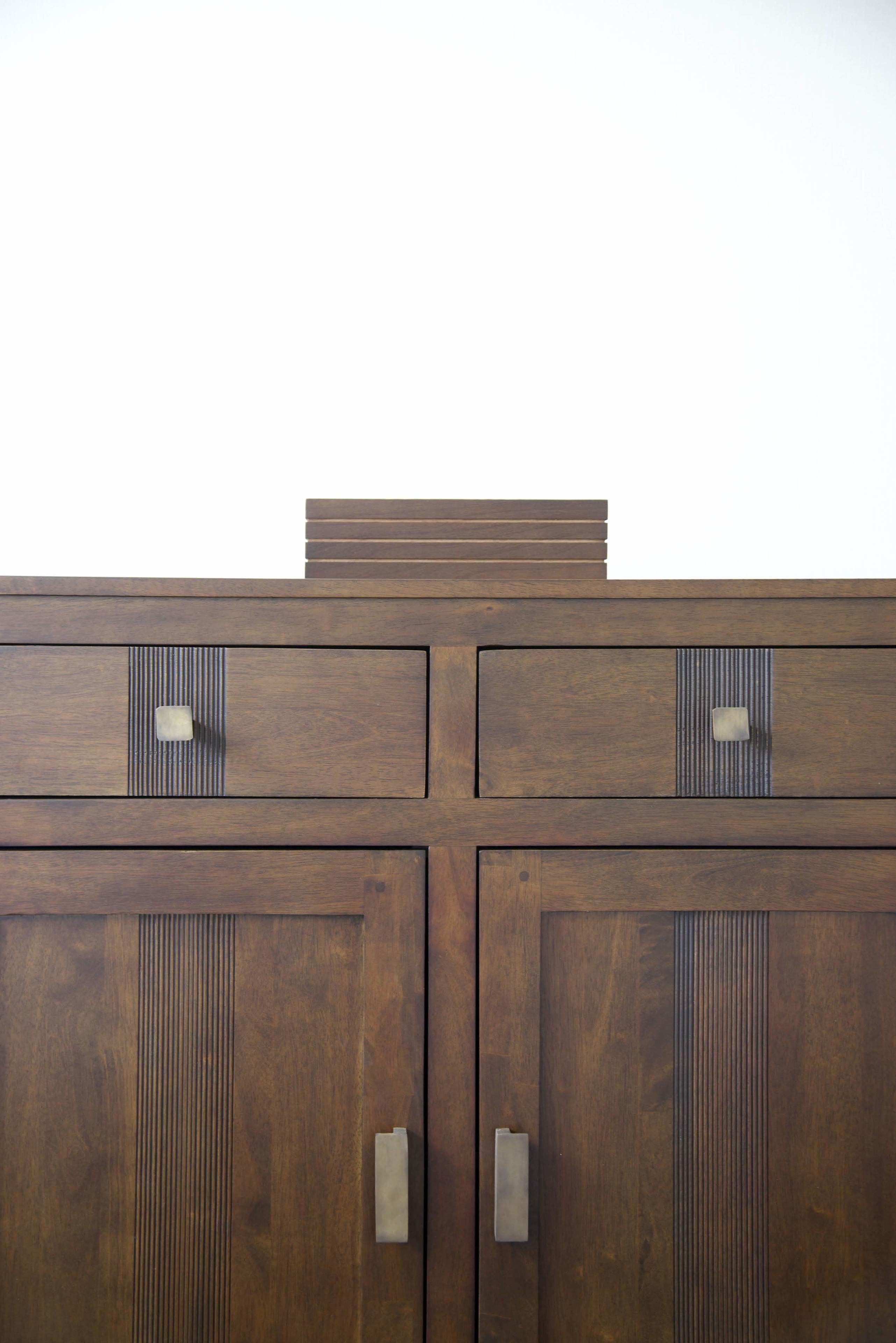 A wooden cabinet with multiple drawers and a flat top surface.