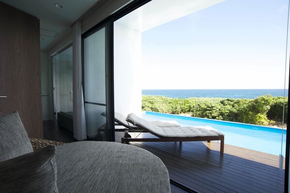 side.B sora, Luxury Condominium with Private Pool | Living room | Flat-screen TV