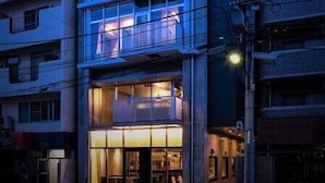 A multi-story hotel with a modern design, featuring balconies and large windows. - KAMON HOTEL Seto (Hiroshima)